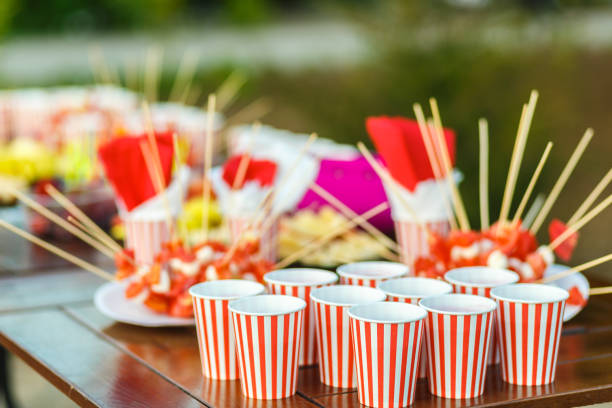 Table with colored sweet snacks. Outdoor party.