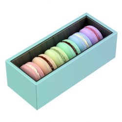 Box with six french macarons with different colors and flavors on white background